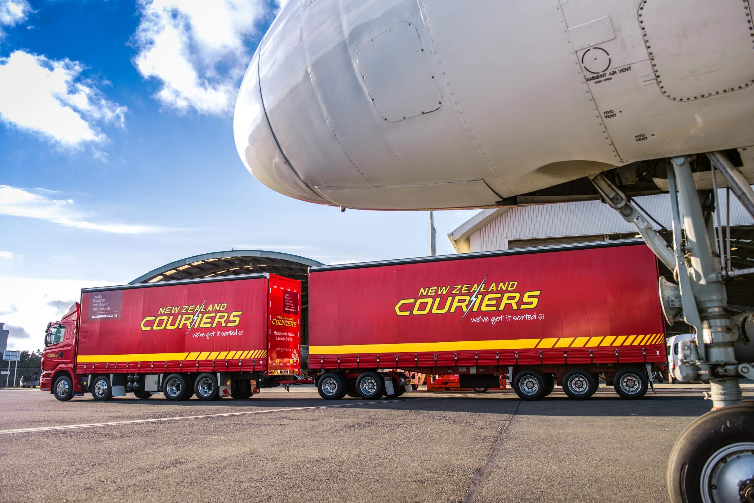 Image of a plane and two trucks